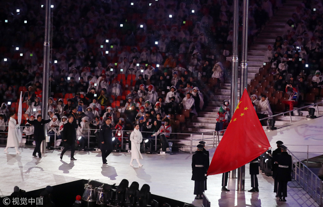 The flag of China, who are the next hosts of the Winter Paralympics in 2022, is raised during the Closing Ceremony for the PyeongChang 2018 Winter Paralympics in South Korea. [Photo: VCG]