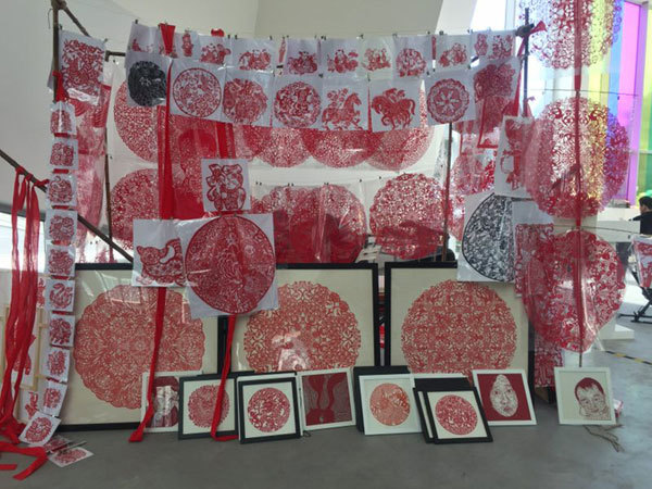 Paper cut art appears as part of Chinese artist Qiu Zhijie's solo exhibition, which records how popular the traditional Lantern Festival used to be among ancient Chinese people. The exhibition opened in Beijing on Friday afternoon, March 16, 2018. [Photo: China Plus/Xu Fei]