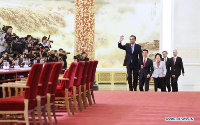 Chinese Premier Li Keqiang, vice premiers Han Zheng, Sun Chunlan, Hu Chunhua and Liu He attend a press conference after the conclusion of the first session of the 13th National People's Congress (NPC) at the Great Hall of the People in Beijing, capital of China, March 20, 2018. [Photo: Xinhua]