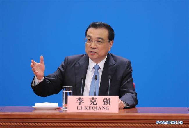 Chinese Premier Li Keqiang answers questions at a press conference after the conclusion of the first session of the 13th National People's Congress (NPC) at the Great Hall of the People in Beijing, capital of China, March 20, 2018.[Photo: Xinhua]