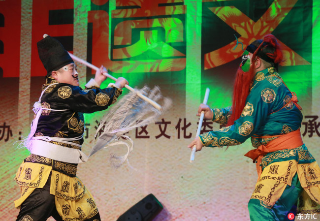 PPerformance of Imperial Academy Five Tiger Choreographic Cudgeling Battle was held in the Haidian District in Beijing. [Photo: from IC]