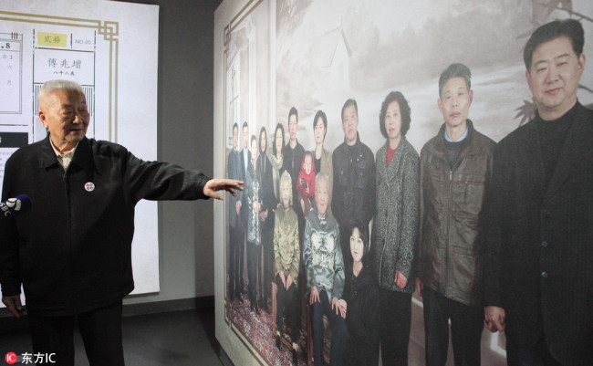 Ge Daorong, a survivor of the Nanjing Massacre, is interviewed by Jiangsu TV in Nanjing, Jiangsu Province, April 3, 2018. An exhibition of family photos of survivors of the Nanjing Massacre opened on Tuesday in Nanjing. [Photo: IC]