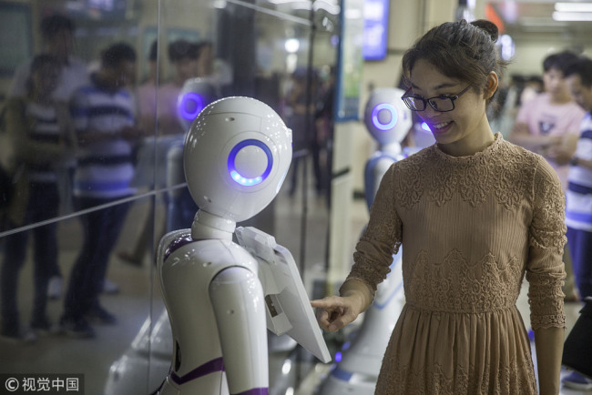 A woman seeking the help from an AI doctor at the Guangdong Second Provincial General Hospital. 