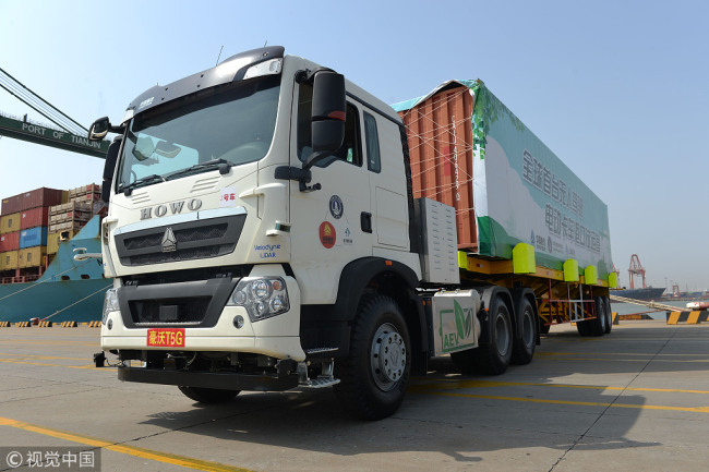 Self-driving electric truck successfully completes testing at Tianjin Port.[Photo: VCG]