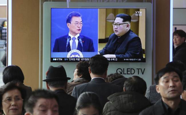 People watch a TV screen showing images of North Korean leader Kim Jong Un and South Korean President Moon Jae-in, at the Seoul Railway Station in Seoul, South Korea. [File photo: AP/Ahn Young-joon]