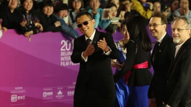 Wong Kar-wai (1st left) during the red-carpet show at this year's Beijing International Film Festival on Sunday, April 15, 2018. [Photo: CGTN]