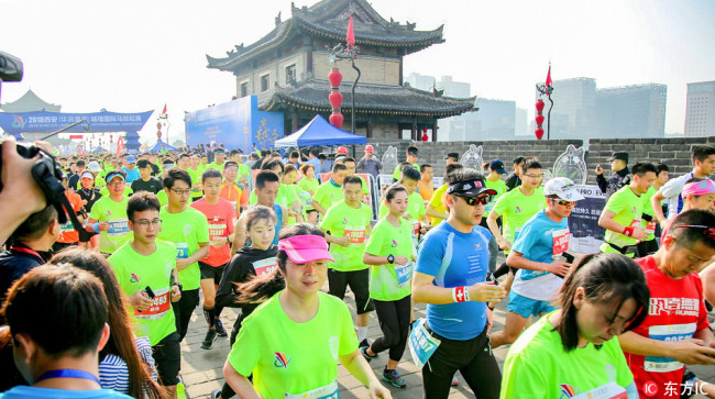 Xi’an holds a unique half-marathon on the circumvallation, one of the oldest, largest and best preserved Chinese city walls, on April 21, 2018. [Photo: IC]