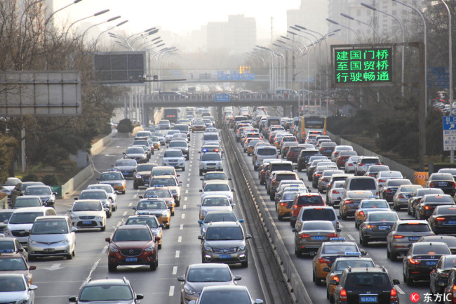 Vehicles are stuck in slow moving traffic during rush hour in Beijing on Wednesday, January 17, 2018. [Photo: IC]