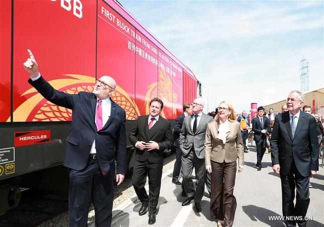 Austrian President Alexander Van der Bellen (2nd R Front), Austrian Minister for Digital and Economic Affairs Margarete Schrambock (4th R, Front), Chinese Ambassador to Austria Li Xiaosi (1st R, Front) and other guests inspect a new China-Europe freight train from Chengdu to Vienna at the Vienna South Freight Center in Vienna, Austria, on April 27, 2018. [Photo: Xinhua]