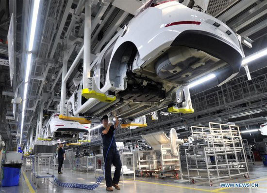 The file photo shows a car making factory in China. [File photo: Xinhua]