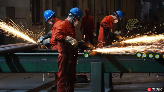Workers work at a steel factory in Dalian, northeast China's Liaoning Province, on March 27, 2018. [File photo: IC]