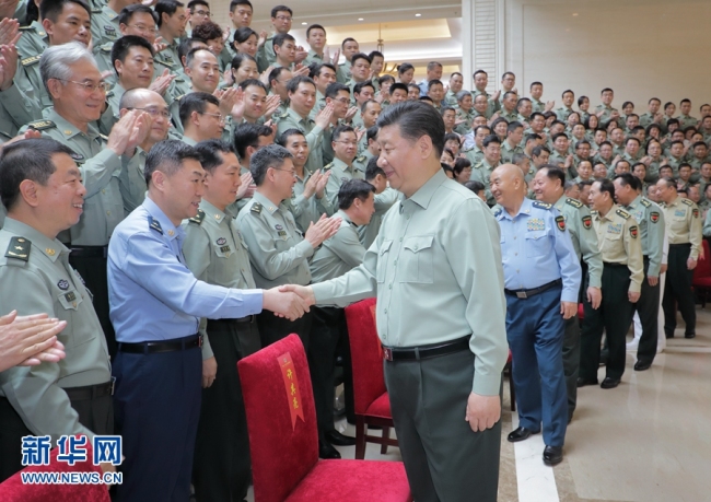 Chinese President Xi Jinping inspects the People's Liberation Army Academy of Military Science in Beijing on May 16, 2018. [Photo: Xinhua]