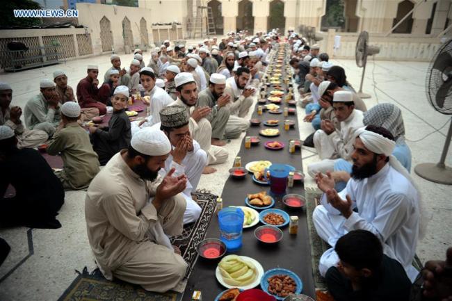 Pakistani Muslims pray before breaking their fast at a mosque on the first day of the holy month of Ramadan in Pakistan's Peshawar on May 17, 2018.
