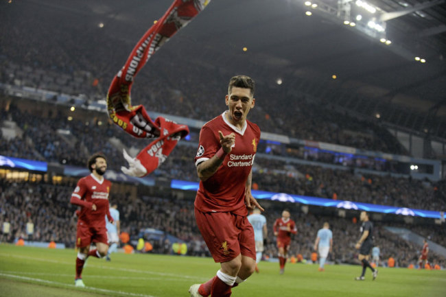 Liverpool's Roberto Firmino celebrates scoring his side's second goal during the Champions League quarterfinal second leg soccer match between Manchester City and Liverpool at Etihad stadium in Manchester, England, Tuesday, April 10, 2018. [Photo: AP]