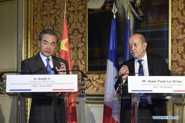 Chinese State Councilor and Foreign Minister Wang Yi (L) and French Foreign Minister Jean-Yves Le Drian hold a press conference after a meeting in Paris, France, May 16, 2018.[Photo: Xinhua]