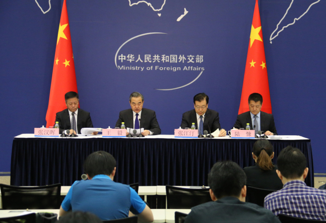 China's State Councilor and Foreign Minister Wang Yi, Assistant Foreign Minister Zhang Hanhui and secretary of the CPC Qingdao Municipal Committee Zhang Jiangting attend a media briefing regarding the upcoming SCO Qingdao Summit in Beijing on Monday, May 28, 2018. [Photo: China Plus]