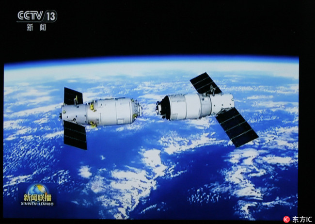 In this TV grab taken by CCTV (China Central Television) on 17 September 2017, the China's first cargo spacecraft, the Tianzhou-1, separating from Tiangong-2 space lab. [Photo: IC]