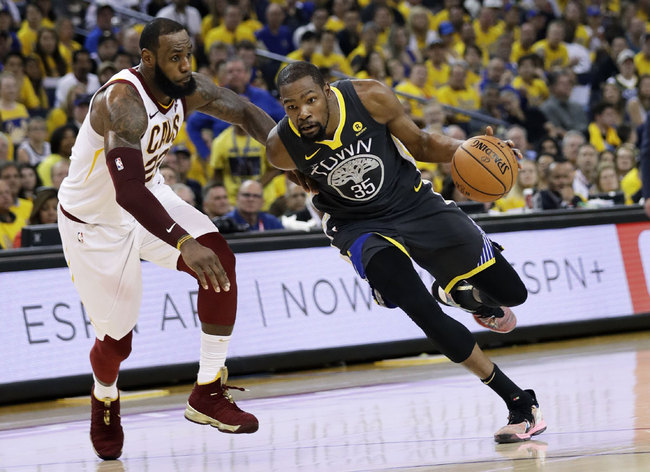 Golden State Warriors forward Kevin Durant (35) drives against Cleveland Cavaliers forward LeBron James during the first half of Game 2 of basketball's NBA Finals in Oakland, Calif., Sunday, June 3, 2018. [Photo: AP]