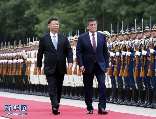 Chinese President Xi Jinping welcomes visiting Kyrgyz President Sooronbay Jeenbekov on June 6, 2018, in Beijing. [Photo: Xinhua]