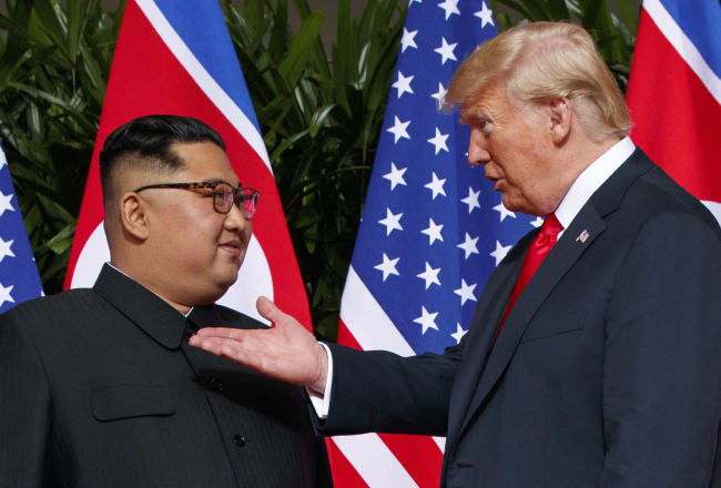 In this June 12, 2018, file photo, U.S. President Donald Trump, right, meets with North Korean leader Kim Jong Un on Sentosa Island in Singapore. [File Photo: AP/Evan Vucci]