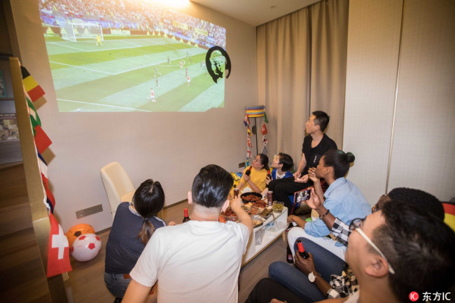 Chinese fans watch the 2018 World Cup at home on Thursday, June 14, 2018. [Photo: IC]