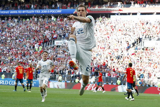 Russia's Artyom Dzyuba celebrates scoring his side's opening goal during the round of 16 match between Spain and Russia at the 2018 soccer World Cup at the Luzhniki Stadium in Moscow, Russia, Sunday, July 1, 2018. [Photo: AP]