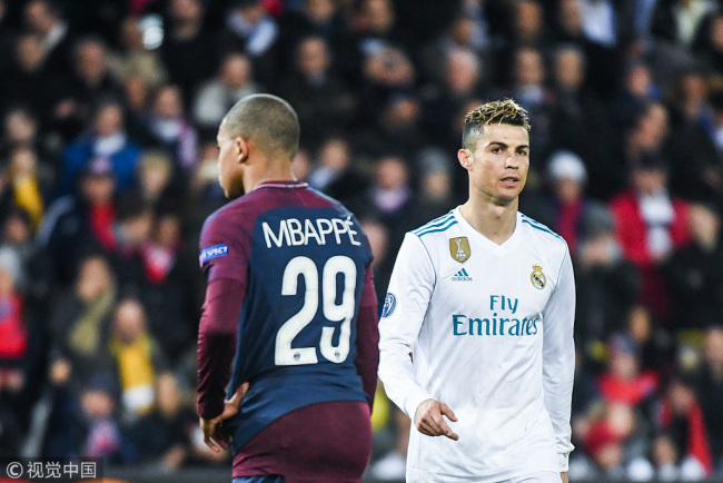 Kylian Mbappe of PSG and Cristiano Ronaldo of Real Madrid during the UEFA Champions League Round of 16 Second Leg match between Paris Saint Germain and Real Madrid at Parc des Princes on March 6, 2018 in Paris, France. [File Photo: VCG]