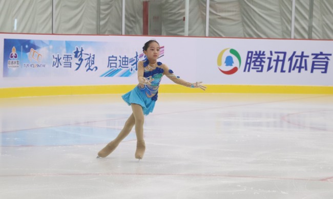 Eleven-year-old Song Zirui poses for a photo at Tus ice and snow sports center in Beijing on July 1, 2018. [Photo: China Plus]