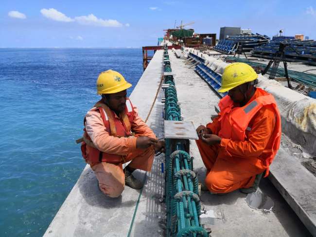 Workers on the China-Maldives Friendship Bridge, July 9, 2018. [Photo: China Plus/Yang Tianshu]