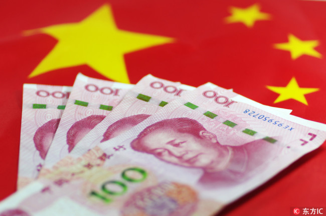 Picture shows flag of China and Chinese notes. [Photo: IC]