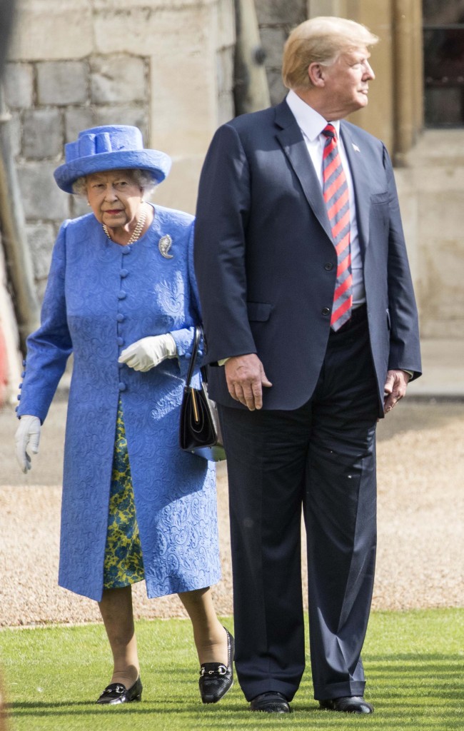 Britain's Queen Elizabeth II, background and US President of the United States Donald Trump walk from the Quadrangle after inspecting the Guard of Honour, during the president's visit to Windsor Castle, Friday, July 13, 2018 in Windsor, England. The monarch welcomed the American president in the courtyard of the royal castle. (Photo: Pool Photo via AP/Richard Pohle)