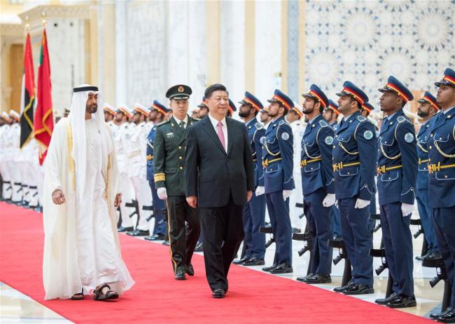 Chinese President Xi Jinping, accompanied by Crown Prince of Abu Dhabi Sheikh Mohammed bin Zayed Al Nahyan, reviews the guard of honor during a grand welcome ceremony in Abu Dhabi, the United Arab Emirates (UAE), July 20, 2018.[Photo: Xinhua/Li Xueren]