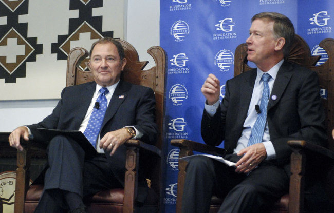 Democratic Colorado Gov. John Hickenlooper, right, and Republican Utah Gov. Gary Herbert talk about strategies for increasing direct foreign investment in state economies Thursday, July 19, 2018, in Santa Fe, N.M. Several governors attending the annual meeting of the National Governors Association said shifting U.S. trade policies are rattling markets for agricultural commodities and complicating decisions by foreign investors.[Photo: AP/Morgan Lee]
