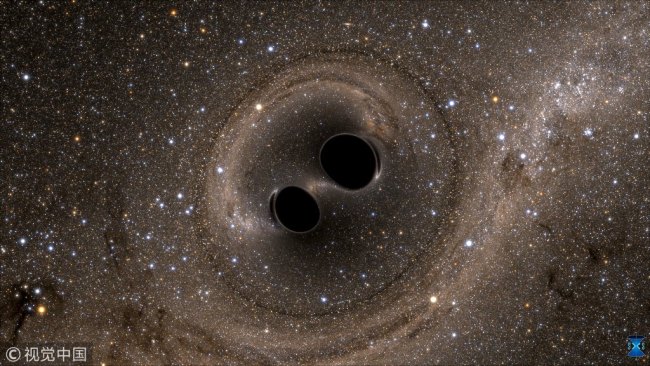 The collision of two black holes - a tremendously powerful event detected for the first time ever by the Laser Interferometer Gravitational-Wave Observatory, or LIGO - is seen in this still image from a computer simulation released in Washington February 11, 2016. [File photo: VCG/Caltech/MIT/LIGO Laboratory/Handout via Reuters]