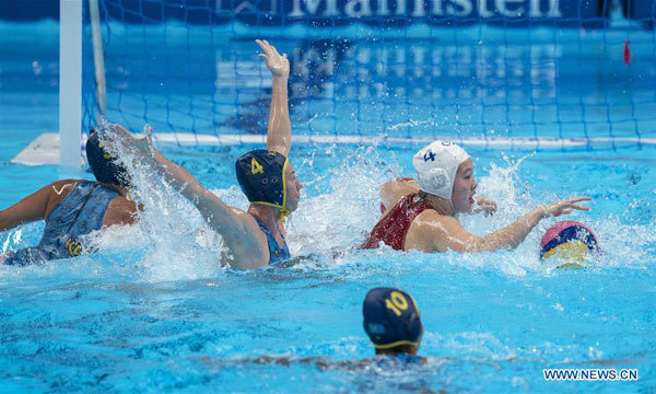Xiong Dunhan (1st R) of China competes during women's water polo tournament Group A match between China and Kazakhstan at the 18th Asian Games in Jakarta, Indonesia, on August 16, 2018. China won 11-4. [Photo: Xinhua/Fei Maohua]