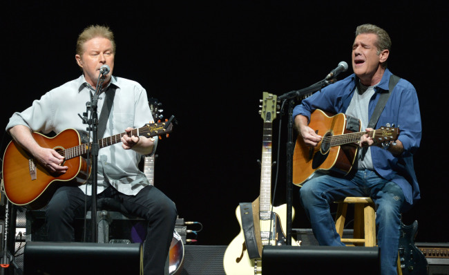 Don Henley, left, and Glenn Frey of The Eagles perform on the "History of the Eagles" tour at the Forum, on Wednesday, Jan. 15, 2014 in Los Angeles. [File Photo: AP/John Shearer]
