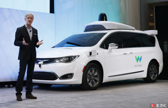 John Krafcik, CEO of Waymo, the autonomous vehicle company created by Google's parent company, Alphabet, introduces a Chrysler Pacifica hybrid at the North American International Auto Show in Detroit. [File Photo: IC]