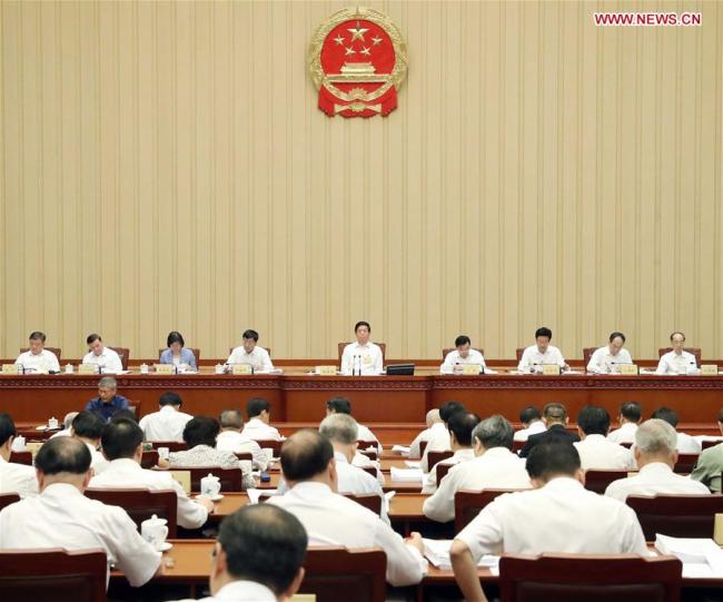 Li Zhanshu, chairman of the National People's Congress (NPC) Standing Committee, presides over a bimonthly session of the 13th NPC Standing Committee at the Great Hall of the People in Beijing, capital of China, Aug. 27, 2018. [Photo: Xinhua]