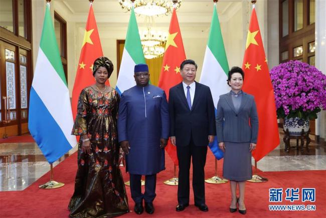 Chinese President Xi Jinping (2nd R) and his wife Peng Liyuan (1st R) pose for photos with Sierra Leonean President Julius Maada Bio (2nd L) and his wife in Beijing on August 30, 2018. [Photo: Xinhua]