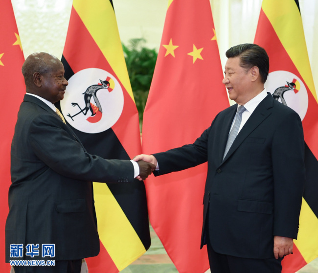 Chinese President Xi Jinping (R) meets with Ugandan President Yoweri Museveni at the Great Hall of the People in Beijing, capital of China, Sept. 5, 2018. [Photo: Xinhua]