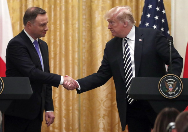 U.S. President Donald Trump shakes hands with Polish President Andrzej Duda, left, during a news conference in the East Room of the White House, Tuesday, Sept. 18, 2018, in Washington. [Photo: AP/Alex Brandon]