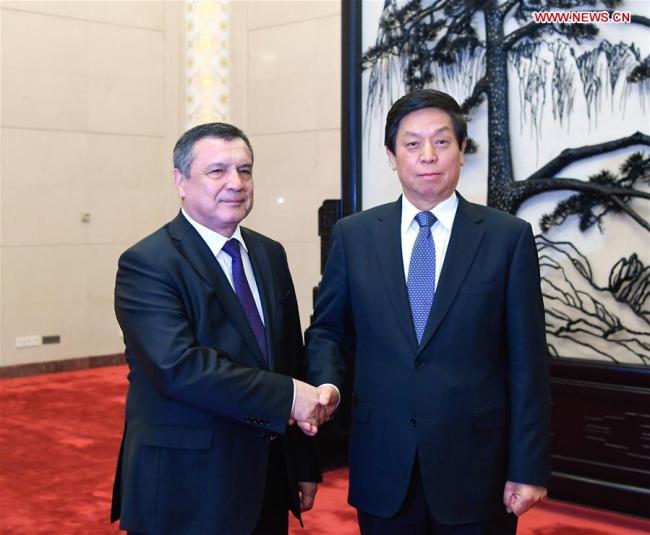 Li Zhanshu, chairman of the Standing Committee of the National People's Congress (NPC), holds talks with Nuriddinjon Ismailov, speaker of the Legislative Chamber of Uzbekistan's Supreme Assembly, at the Great Hall of the People in Beijing, capital of China, Sept. 18, 2018. [Photo: Xinhua]