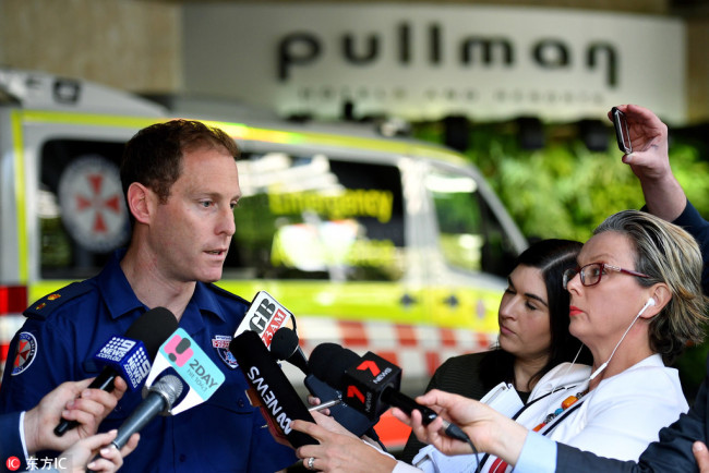 New South Wales Ambulance Acting Superintendent Steve Vaughan speaks to the media at the scene of a chemical leak at the Pullman Hotel in Sydney, Australia, September 19, 2018. [Photo: EPA/Joel Carrett]