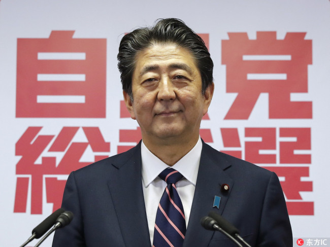 Japan's Prime Minister and President of the ruling Liberal Democratic Party (LDP) Shinzo Abe speaks at his news conference at the LDP headquarters in Tokyo, Japan, 20 September 2018 after being re-elected as President of the LDP.[Photo: IC]