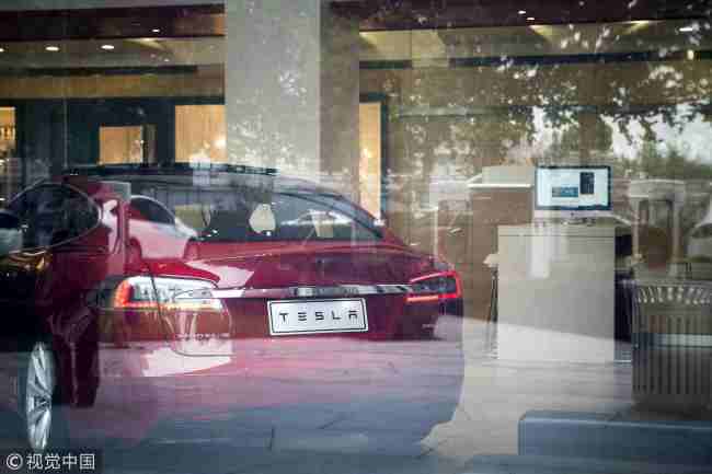 A Tesla Inc. Model S electric vehicle sits on display at the company's showroom in Beijing on Saturday, July 7, 2018. [Photo: VCG]