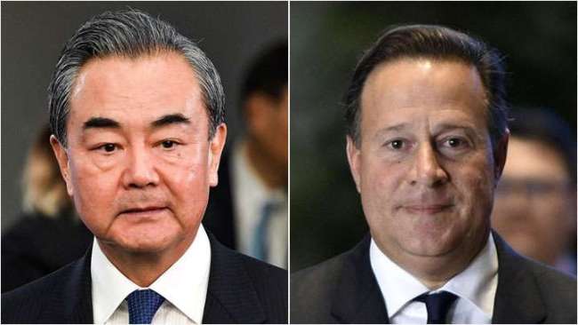 Chinese Foreign Minister Wang Yi（left）and Panamanian President Juan Carlos Varela.[Photo:China Plus]