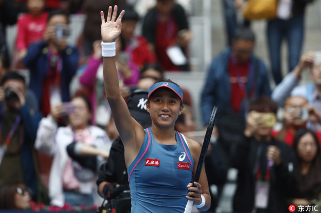 Zhang Shuai celebrates during the women's third round singles match after she defeated Angelique Kerber of Germany at the China Open tennis tournament in Beijing, China, 04 October 2018. [Photo: IC]