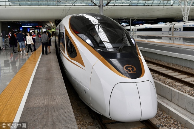 A CIIE-themed train stops at a platform of Shanghai Hongqiao Railway Station in Shanghai before its departure for Beijing on Wednesday morning, October 10, 2018. [Photo: VCG]