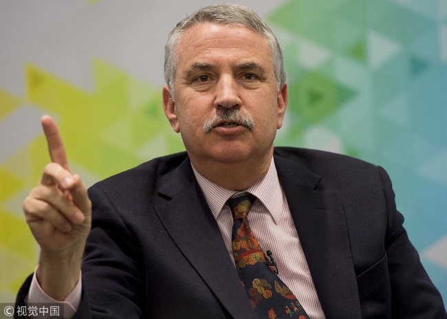 Author Thomas Friedman speaks about his new book, "Thank You for Being Late: An Optimist's Guide to Thriving in the Age of Acceleration," during a discussion with IMF Managing Director Christine Lagarde(not shown) at IMF Headquarters in Washington, DC, January 5, 2017. [Photo: VCG]