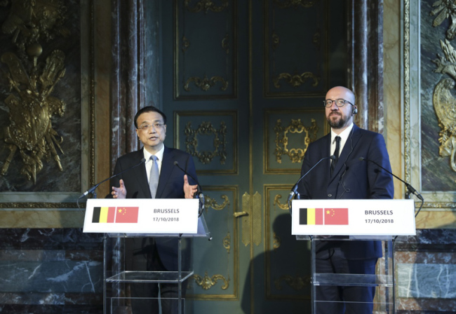Chinese Premier Li Keqiang (L) speaks at a joint press conference with Belgian Prime Minister Charles Michel in Brussels, Belgium on Wednesday, October 17, 2018. [Photo: Xinhua]